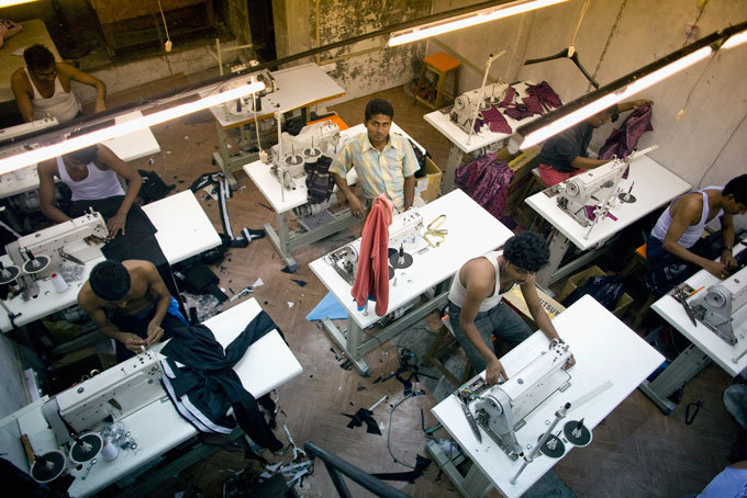 Overhead shot of male factory workers in Mumbai.